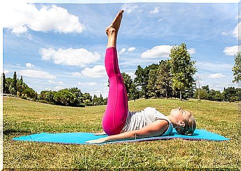 Woman training on a matte