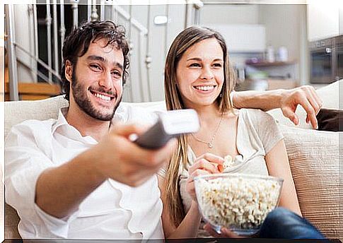 Couple watching movies with popcorn