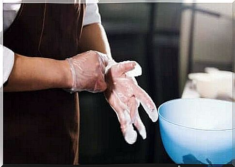 Person wears gloves to avoid cross-contamination