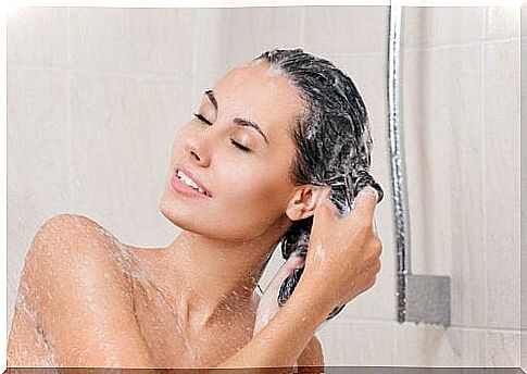 Woman uses shampoo