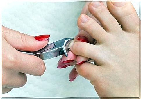 Woman getting clipped toenails