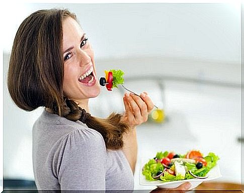 Woman eating salad