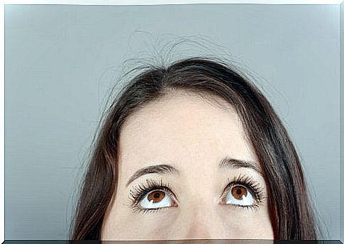 Woman looking upwards - overcoming sadness