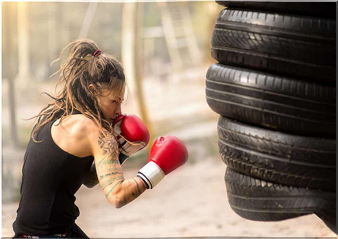 Woman practicing boxing training at home