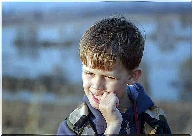 A child bites nails