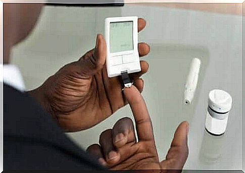 Man checking blood sugar