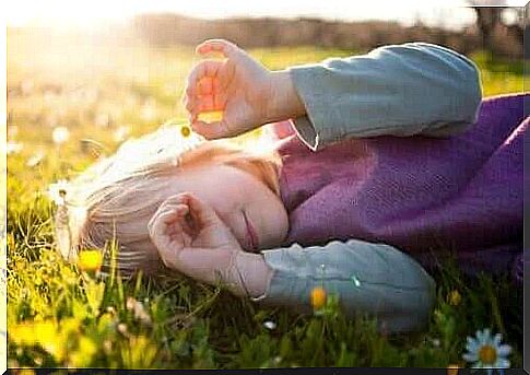 Child lying on lawn