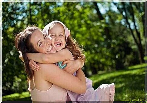 Happy mother and daughter hugging