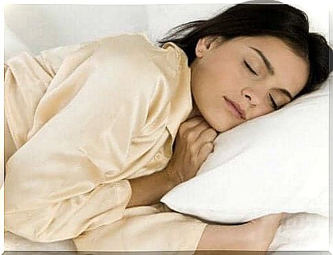 Woman sleeps as part of keeping psoriasis at bay