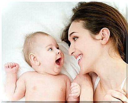 Smiling mother and baby