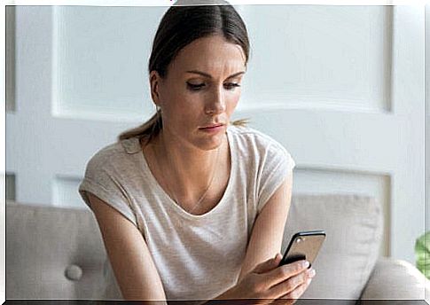 Woman with phone is obsessed with an ex