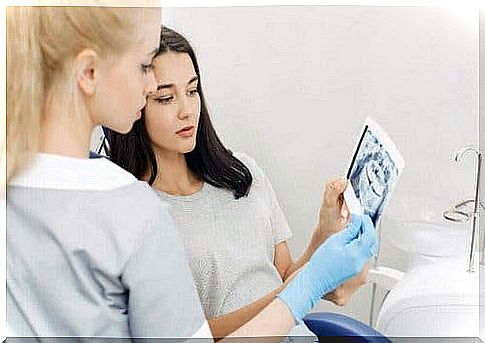 Dentist talking to patient