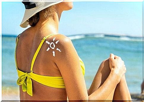 Woman with sunscreen on back