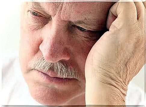 A man looks down and is worried about dementia and Alzheimer's