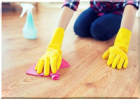 Cleaning with yellow rubber gloves on