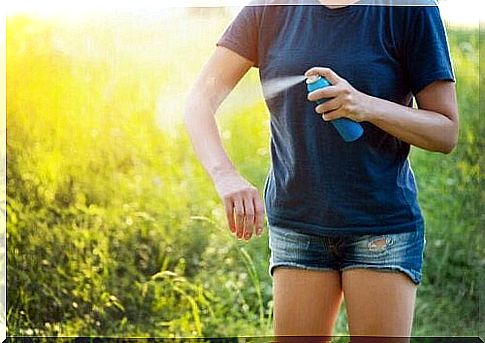 Woman gets mosquito spray on