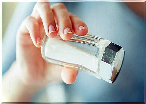 Woman pouring something salty