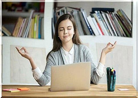 Woman meditating at work