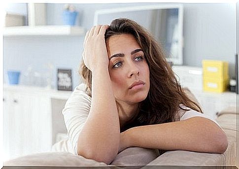 Woman on sofa depressed